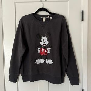 Black crew neck sweater with sequin Mickey Mouse on front